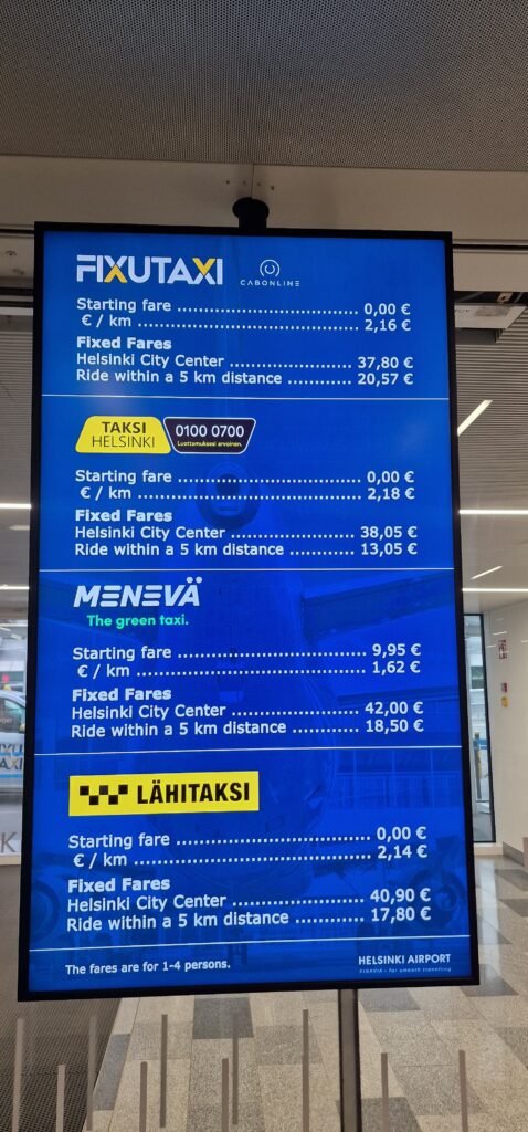 Helsinki Airport taxi fixed-price signage 2026
