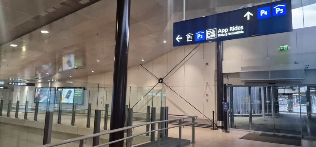 Step 3 - Keep following the P2/AppRides signs. The escalators and the huge drop to the underground train station on your left is an amazing photo opportunity as well!